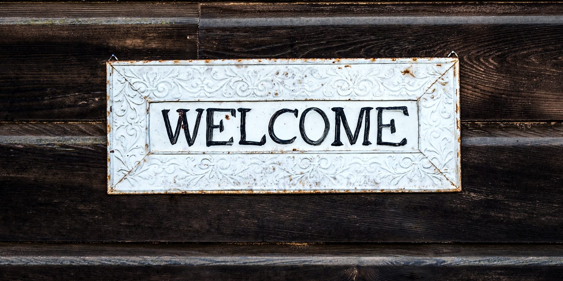 Welcome sign on wood
