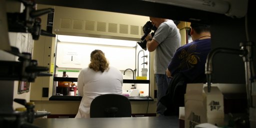 A woman researcher is being filmed
