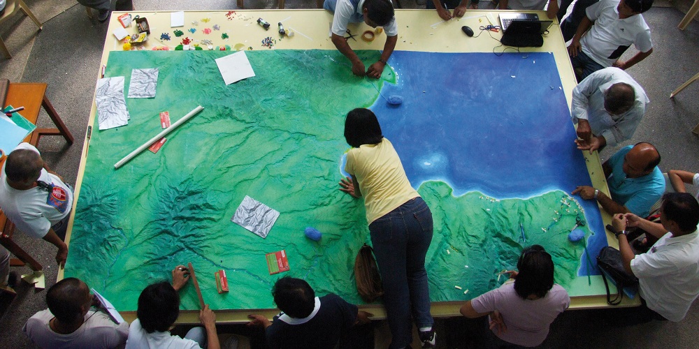 A group of people mapping area