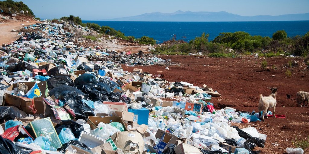 Mountain of rubbish and garbage on the beach by the sea