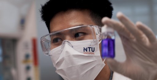close-up of scientist holding lab tool