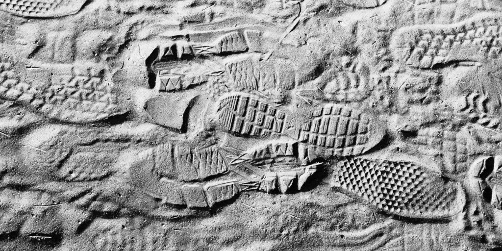 Footprints in sand greyscale