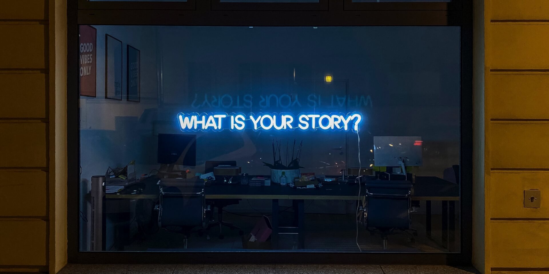 Neon sign with the words what is your story