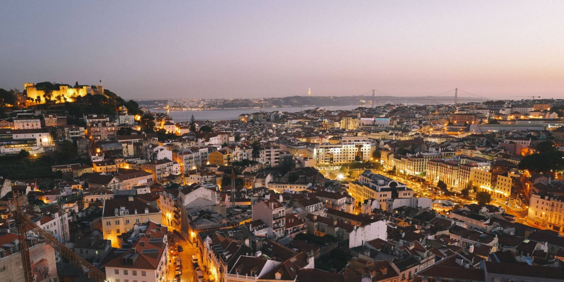 A landscape view of Lisbon city in the evening