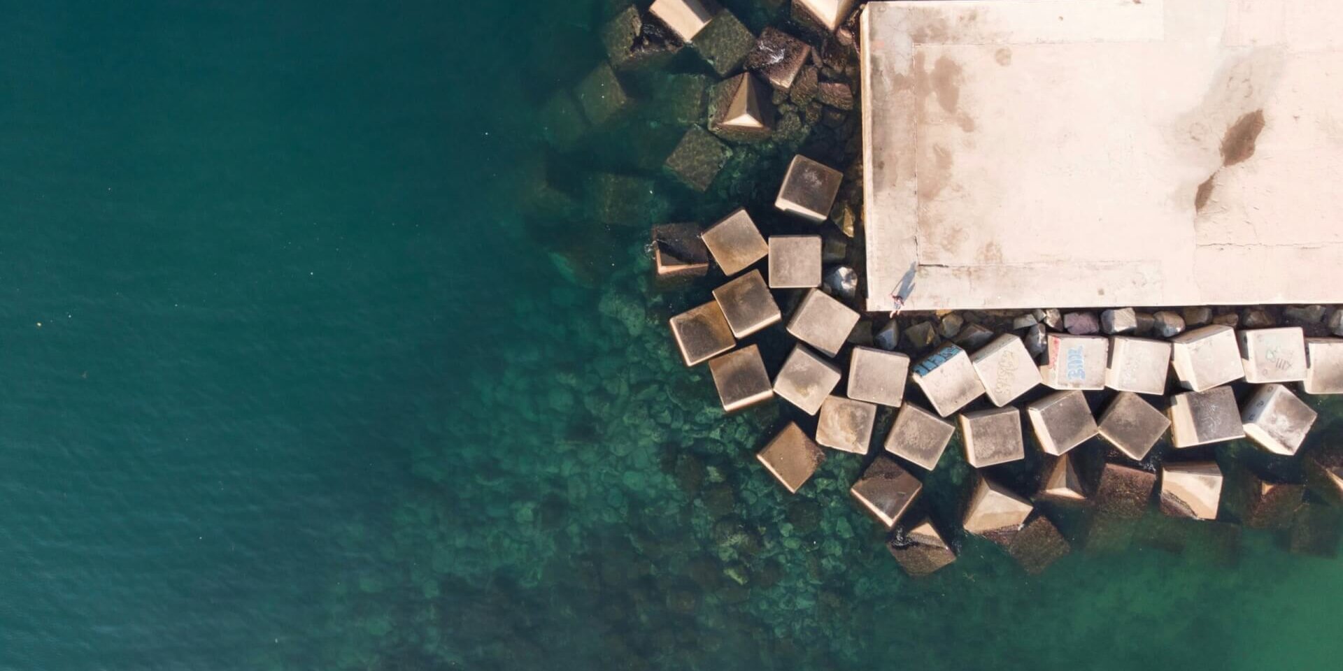 A top view of a dock surrounded by water