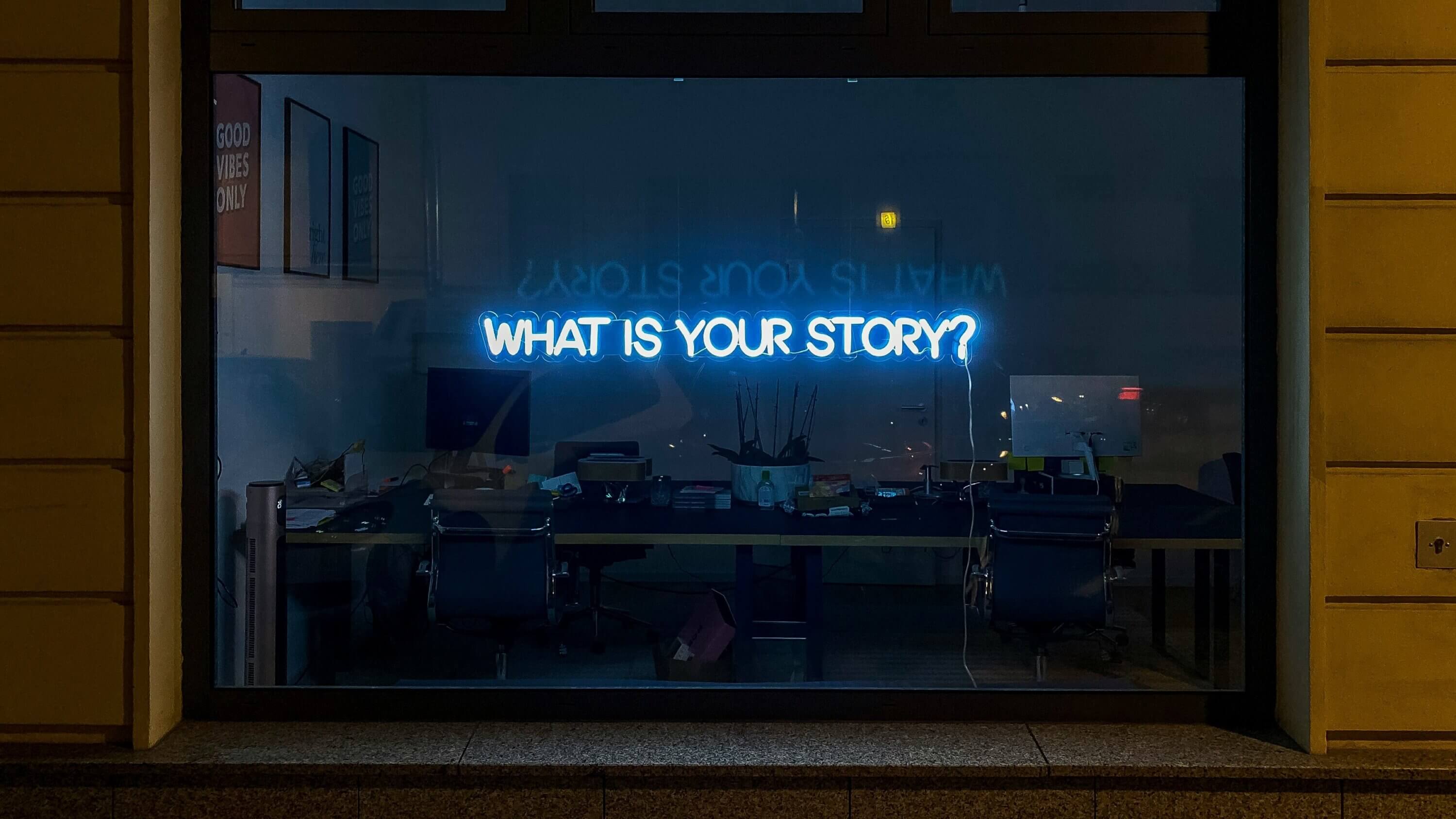 Neon sign with the words what is your story