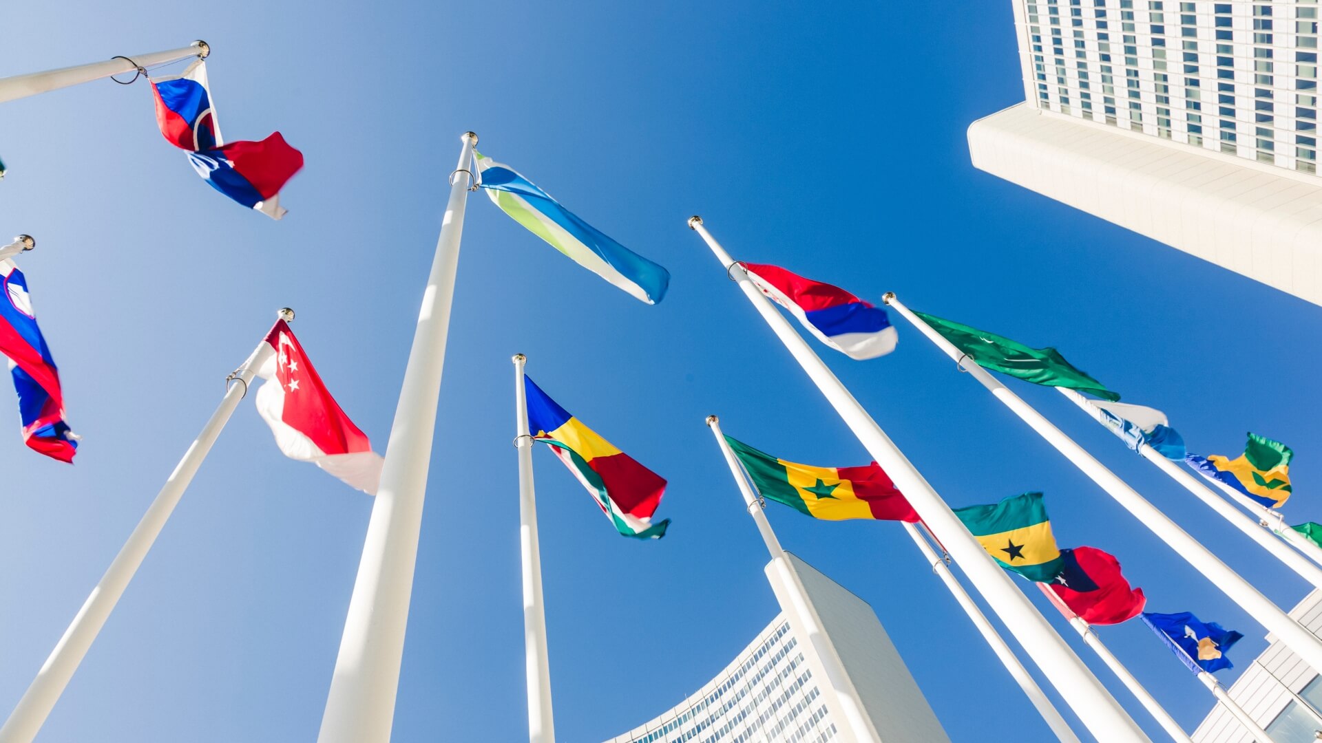 Flags waving against the blue sky