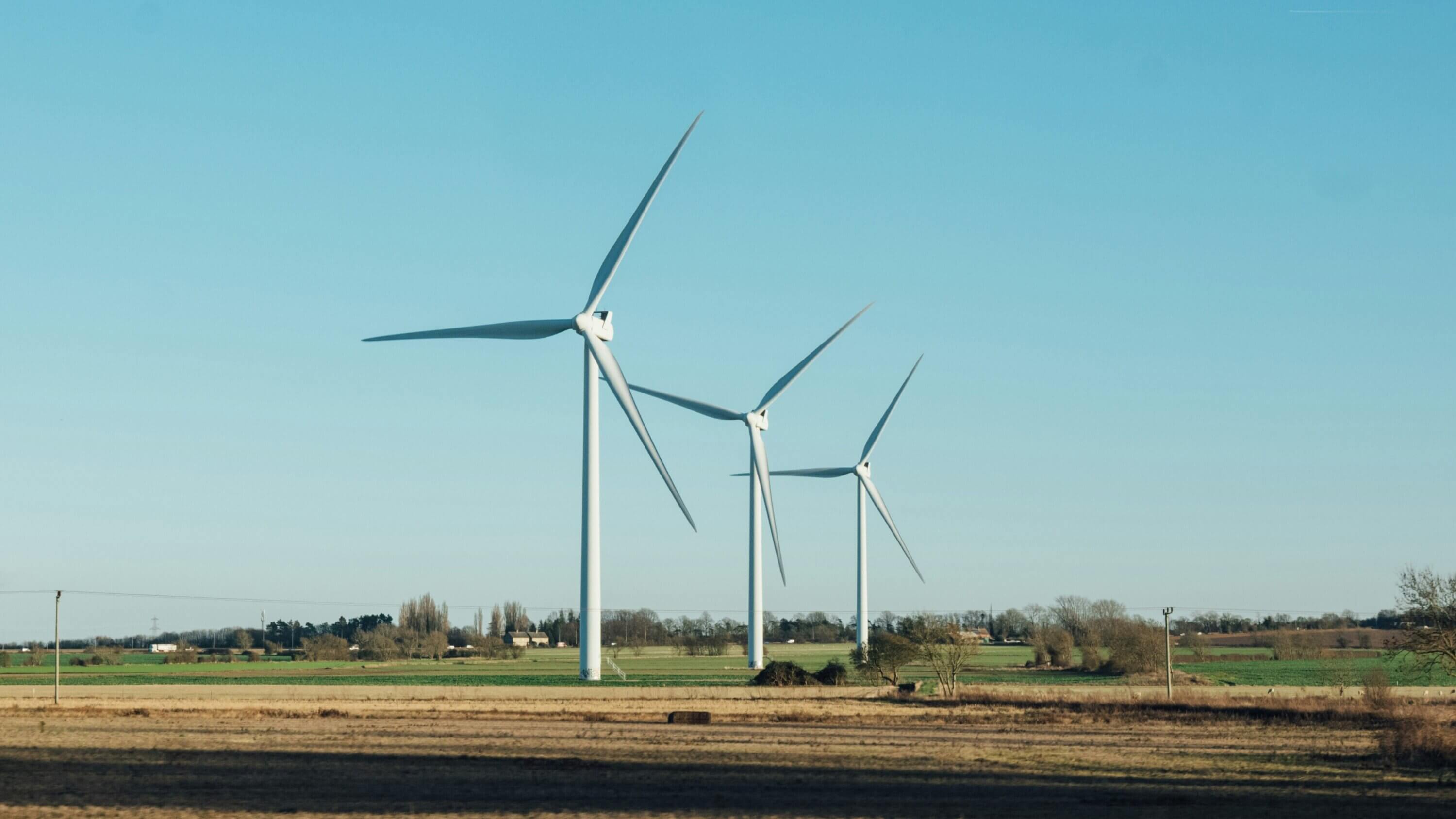 3 wind turbines in a field