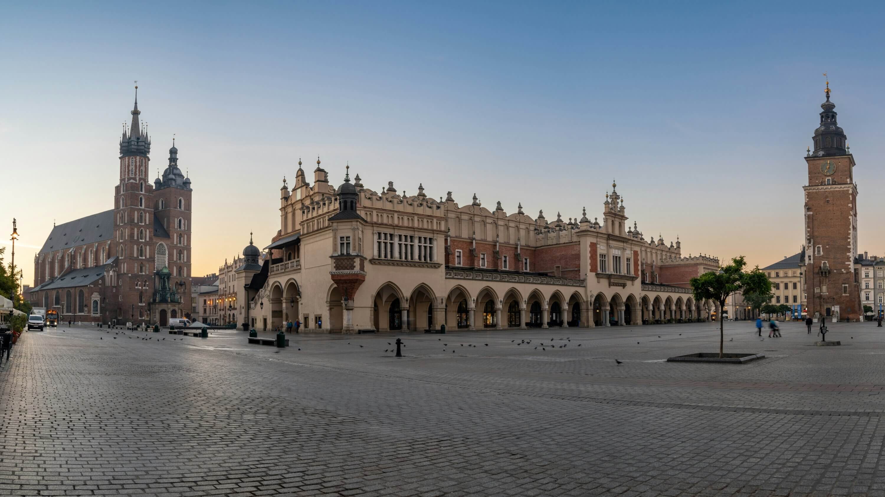 Poland, Krakow city square with a clock tower in the background